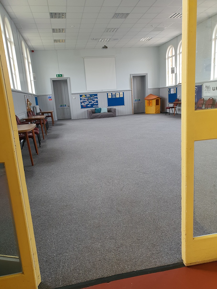 Inner hall access to main hall through oversize door